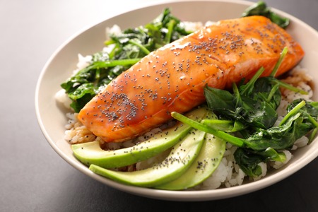 salmon fish with rice,spinach and avocadoの写真素材