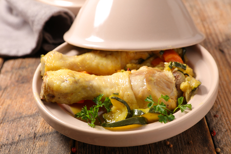 chicken leg with vegetable and brothの写真素材