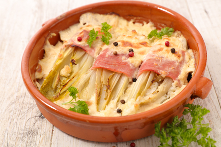 baked chicory with ham and creamの写真素材