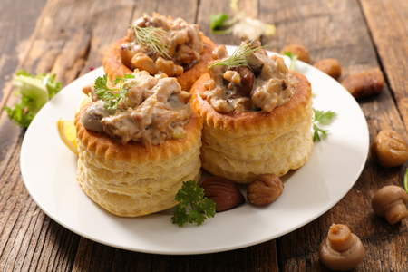 filling puff pastry with mushroom,cream and chickenの写真素材