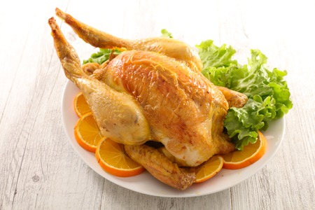 roast chicken with salad and orangeの写真素材