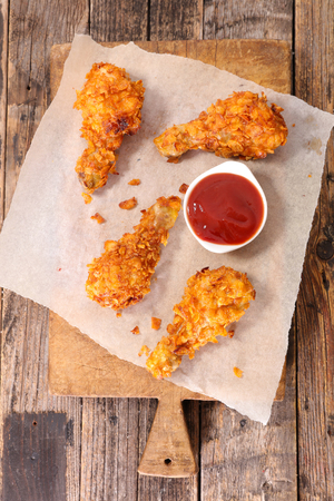 crispy chicken leg and ketchupの写真素材