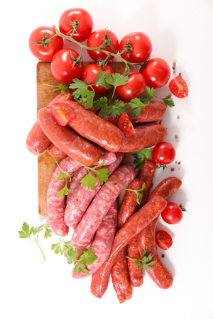 assorted raw sausage on white backgroundの写真素材