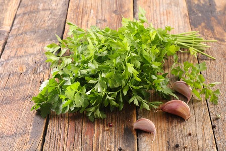 parsley on wood backgroundの写真素材