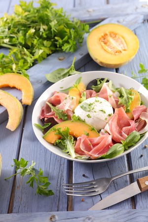 melon, mozzarella and prosciutto ham saladの写真素材