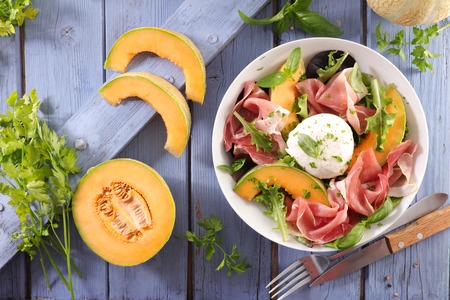 melon, mozzarella and prosciutto ham saladの写真素材