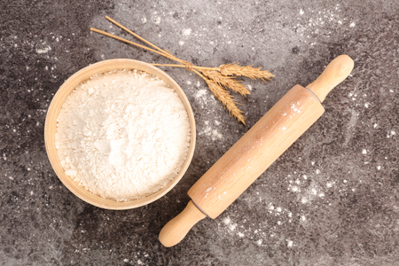 bowl of flour and rolling pinの写真素材