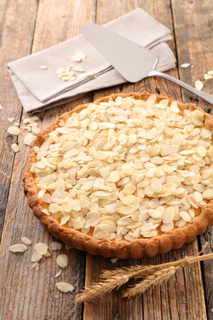 almond cake on wood backgroundの写真素材