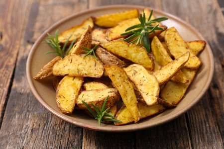 fried potato and rosemaryの写真素材