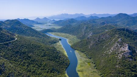 panormic view of lake skadar in Montenegro, famous site touristic with river and mountainの写真素材
