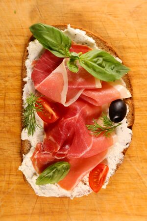 bread sandwich with cheese cream and prosciutto hamの写真素材