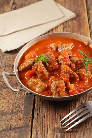 beef stew with tomato sauce and herbsの写真素材