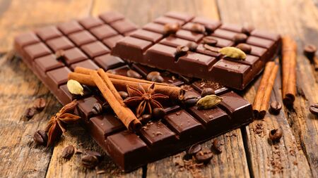 chocolate bar with spices on white backgroundの写真素材