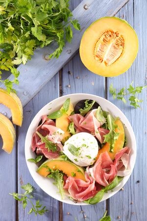 melon, prosciutto ham and mozzarella saladの写真素材