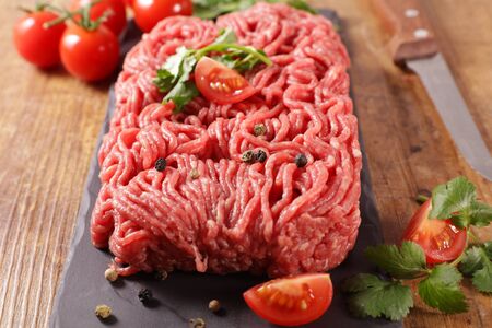 raw minced beef with herb and tomatoの写真素材