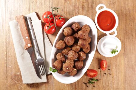 fried meatball with tomato sauceの写真素材