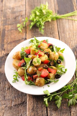 potato salad with tomato, lettuce and oliveの写真素材