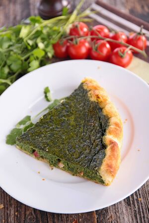 spinach tart slice in plateの写真素材