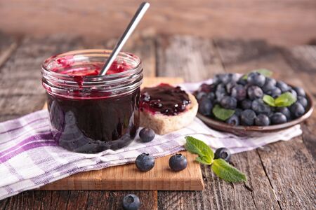blueberry jam on wooden boardの写真素材