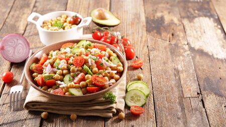 chickpea salad with tomato and avocadoの写真素材