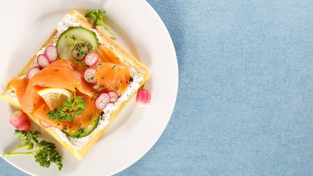 waffle with smoked salmon and vegetableの写真素材