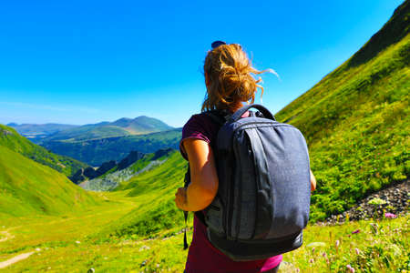 woman hiker and backpack looking at the view