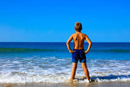 boy, foot on the sea- beautiful beach