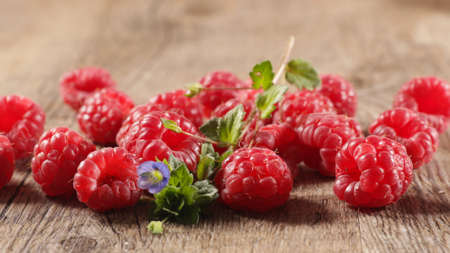 fresh raspberries fruits and leaf