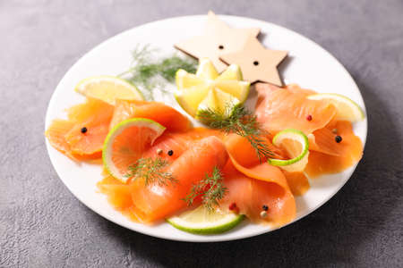 smoked salmon with lemon and dillの写真素材