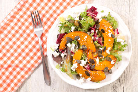 grilled pumpkin slice salad with lettuce and cheeseの写真素材