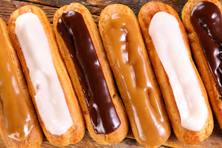 chocolate, vanilla and coffee eclair- french traditional pastryの写真素材