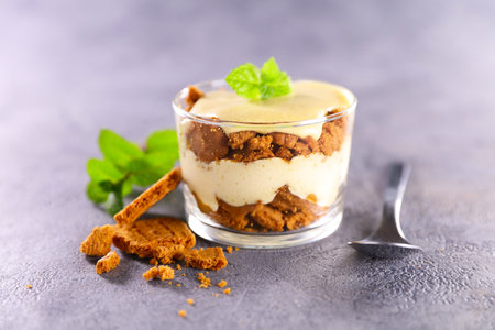 delicious tiramisu cake and spoonの写真素材