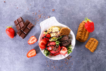 ice cream with berry fruit and biscuitの写真素材