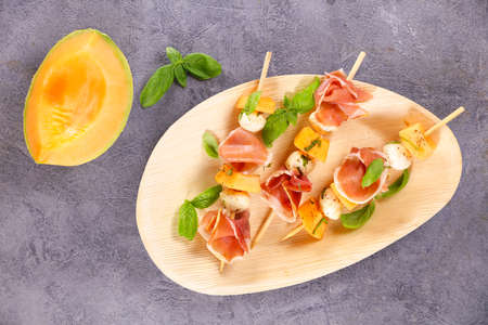 melon, ham and mozzerella stick for entreeの写真素材