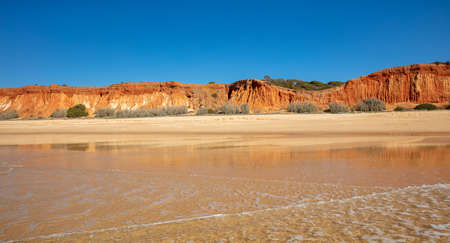 beautiful view of red cliff- atlantic ocean, Algarve in Portugalの写真素材