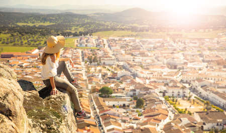 woman enjoying panoramic view of Spain city- Burguillos del Cerro