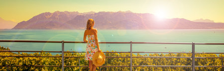 woman enjoying view of Leman lake and vineyardの写真素材