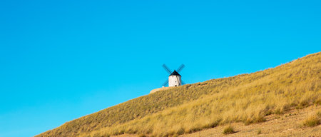 Windmill in countryside and blue skyの写真素材