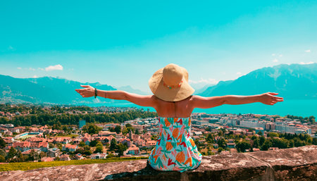 Woman tourist looking at panoramic view of Genova skyline- lake Leman in Switzerlandの写真素材