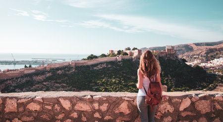 Woman tourist looking at Alcazaba of Almeria- Andalusia in Spainの写真素材