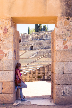 Woman tourist looking at amphitheater of Merida, Famous city in Estremadura, Spainの写真素材