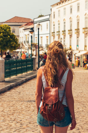 woman walking in the street of Tavira- Travel in Algarve, tour tourism in Portugalの写真素材
