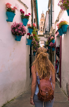 Woman walking in the street of Cordoba- Andalusia in Spainの写真素材