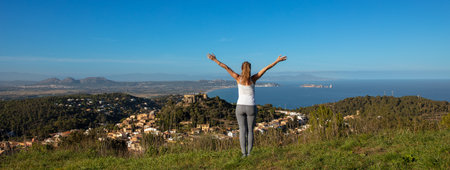 Woman tourist enjoying panoramic view of Begur- Spain, Catalonia, costa brava