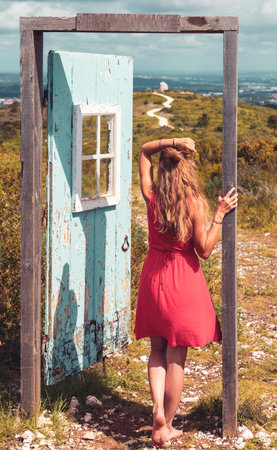 Woman and door in the nature- freedom, lifestyle, travel conceptの写真素材