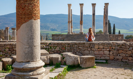 Traveler caucasian woman in Morocco- Roman ruins of Volubilis- Meknes provinceの写真素材