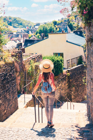 Woman tourist walking in Morlaix street- Brittany in France