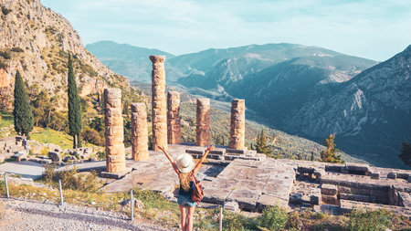Ancient city of Delphi, ruins of the temple of Apollo and tourist people - Travel, tour tourism in...