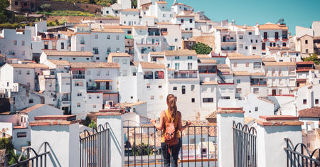 Woman tourist enjoying view of Setenil de las Bodegas white village in Spainの写真素材