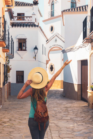 Female tourist visiting white village in Andalusia-Spainの写真素材